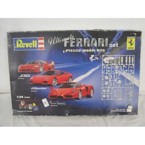 68 - A Revell Plastic model kit of a Ferrari .looks to be one car with paints ,Glue  etc but stored in a ... 