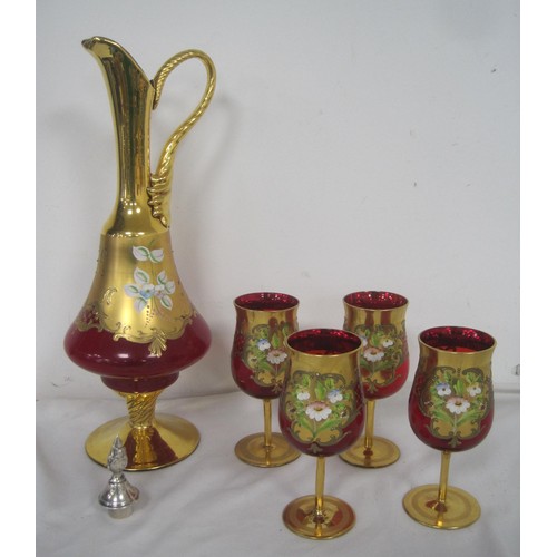 69 - A set of Murano or Venetian hand painted over gold four wine glasses and a handled jug .