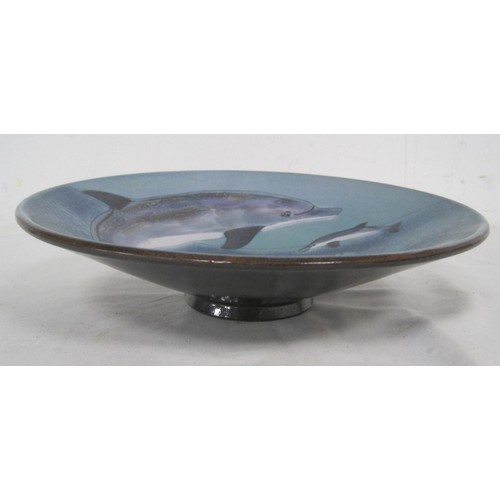 101 - A Chelsea Pottery 10 inch charger bowl in pristine condition featuring swimming and leaping Dolphins... 