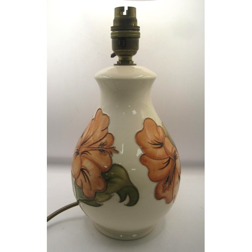 85 - Moorcroft lamp base in the Hibiscus Design in full working order. Mint condition no damage of any so... 