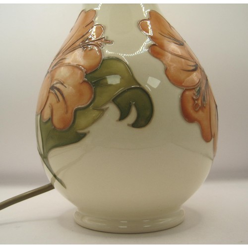 85 - Moorcroft lamp base in the Hibiscus Design in full working order. Mint condition no damage of any so... 