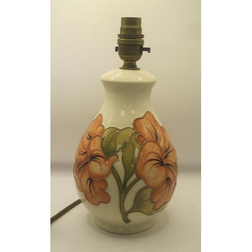 85 - Moorcroft lamp base in the Hibiscus Design in full working order. Mint condition no damage of any so... 