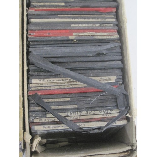 111 - Lot one Two boxes of glass slides containing a selection of religious slides including many early te... 