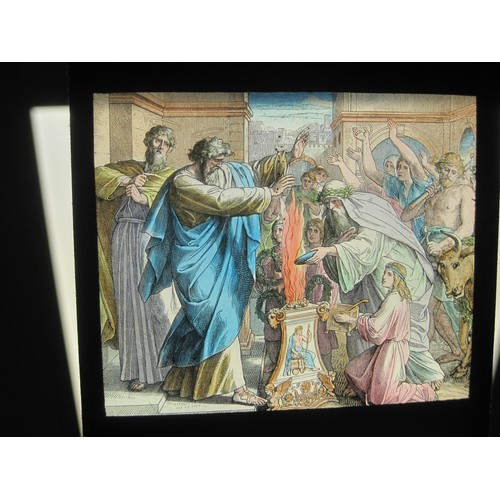 111 - Lot one Two boxes of glass slides containing a selection of religious slides including many early te... 