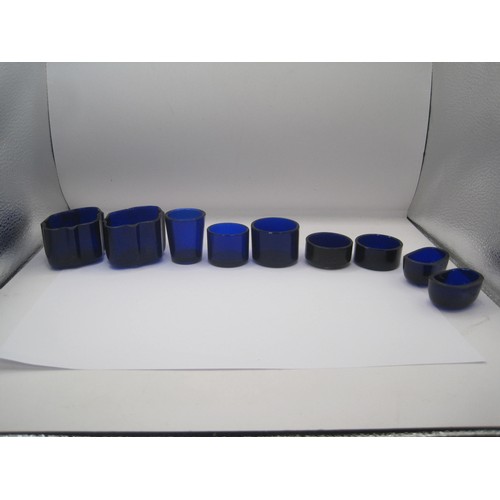 121 - Nine assorted blue glass liners for mustards and cruets