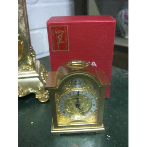 207 - A boxed Swiza carriage-style clock and a brass finished grandfather clock