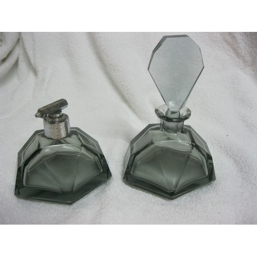 250 - A smokey grey art deco scent bottle, lidded pot and matching atomiser, the atomiser requires a new r... 