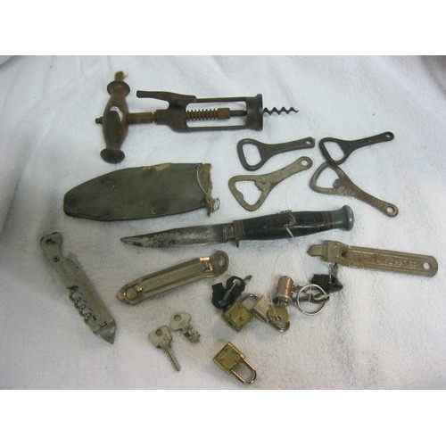 255 - An antique sheath knife, various bottle openers and corkscrews included branded and a number of smal... 