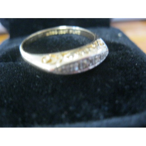 131 - An 18 carat gold ring set with 5 diamonds in a platinum mount, ring size R, approx weight 2.7g