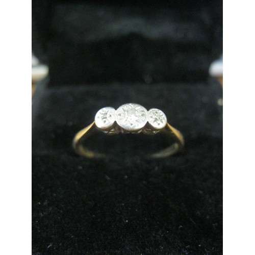 132 - A 9 carat gold ring set with 3 diamonds in a palladium mount, ring size N/O, approx weight 1.4g