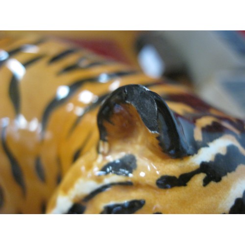 128 - A Beswick Green Woodpecker (slight a/f - chip to base), a Beswick Tiger (slight a/f - chip to ear) a... 