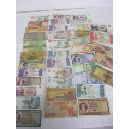 53 - 40 African banknotes, mixed condition, from a wide range of countries including South Africa, Angola... 