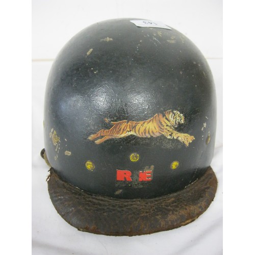 143 - A vintage motorcycle helmet with leather peak and liner, amateurly badged for 'Royal Enfield', in go... 