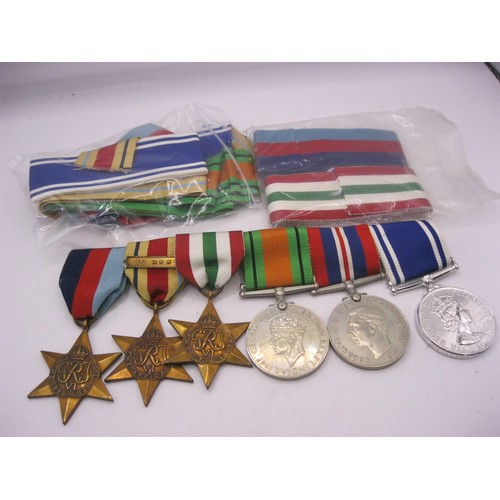 1 - A mounted set of 6 medals comprising the 1939-45 Star, Africa Star with 1st Army clasp, Italy Star, ... 