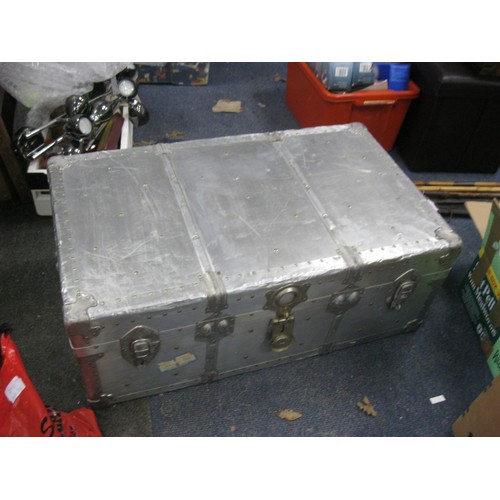 150 - A large aluminium travel trunk in good order, silk lined interior with fitted tray, PanAm labels to ... 