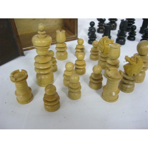 164 - A nicely turned set of wooden chess pieces in original box, all in good order