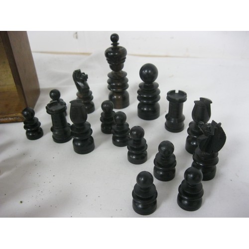 164 - A nicely turned set of wooden chess pieces in original box, all in good order