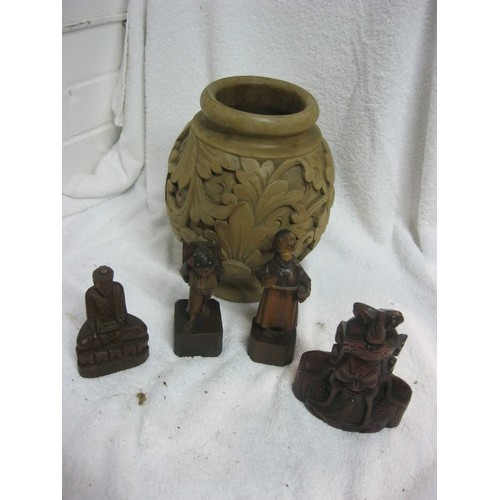 409 - A heavy carved wooden pot plus several carved wooden figures, a couple Oriental