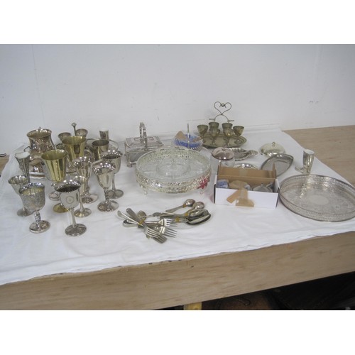 167 - An assortment of electroplated dining and table ware, including trays, goblets, egg cruets, cutlery,... 