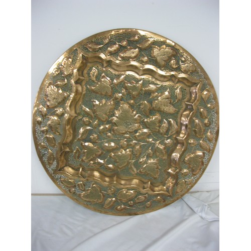 174 - A reticulated copper plaque in good order, interesting design