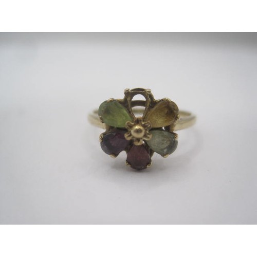 190 - A 9 carat gold multi-stone ring (a/f one stone missing). A foliate setting of five variously coloure... 