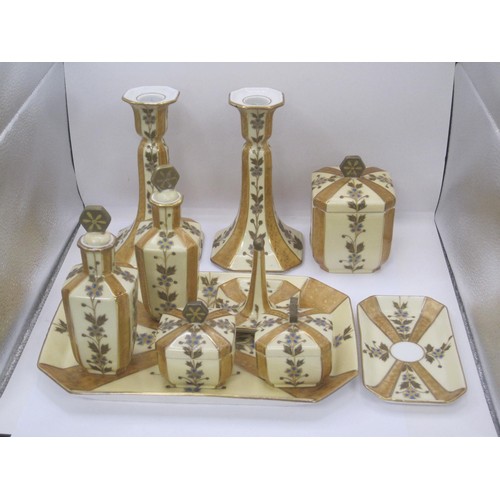 194 - A Limoges Art Deco 10pc Dressing Table Set, comprising tray, candlesticks, x2 scent bottles, large j... 