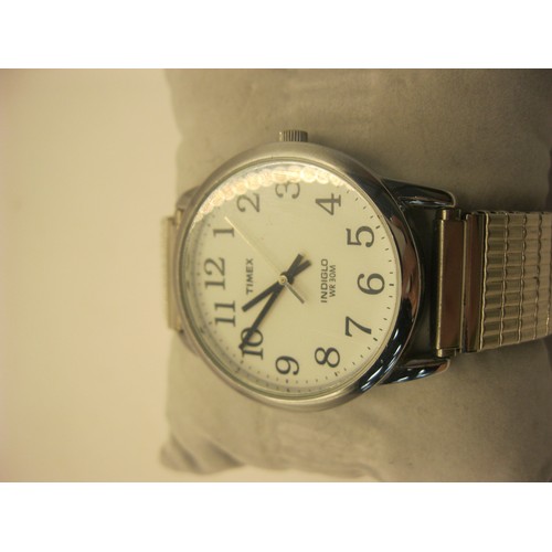 95 - Three gents quartz wristwatches - a Timex Indiglo stainless steel with baton and Arabic numerals and... 