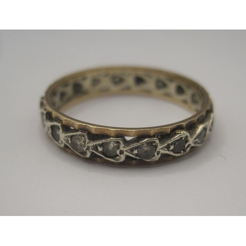 91 - A yellow metal eternity style ring set with white stones, indistinct stamped mark, ring size O, gros... 