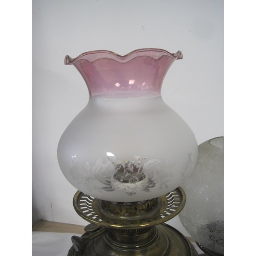 21 - Three oil lamps (two of which have etched glass shade, Maple Hinks Patent and Messenger No. 2), and ... 