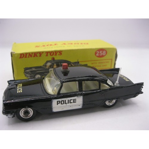 38 - A Dinky Toys #258 USA Police Car (DeSoto Fireflite), minor marks but very good throughout, with ligh... 