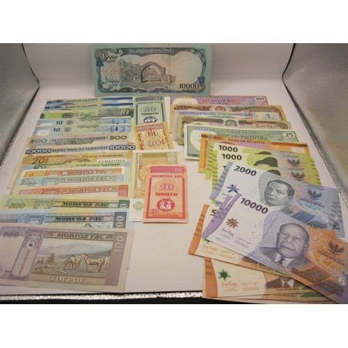 15 - 37 assorted banknotes primarily from Asia and Africa, many in uncirculated condition