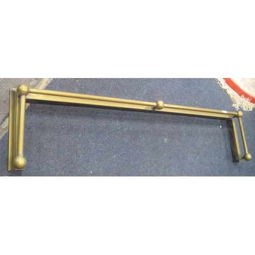 60 - A brass fender with tube and ball rail. Width 125cm, depth 30cm