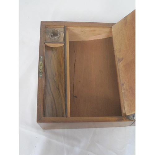 63 - Small mahogany writing slope with glass inkwell and key. Dimensions closed 13cm x 21cm x 26cm