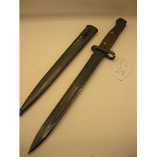 89 - A Yugoslavian M1948 bayonet for the Mauser rifle in its steel scabbard. Makers mark to the ricasso N... 