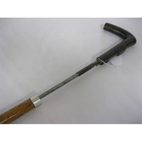 98 - A cane shafted sword stick with a 50.5cms square section blade and bone handle. Having a press stud ... 