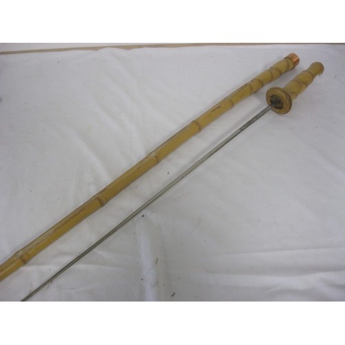 101 - A bamboo shafted sword stick with a 63cms coloured decorated   rectangular blade, with an overall le... 