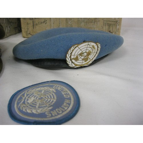 96 - A 9th/12th Lancers (IX-XII) officers cap with gilt badge in its Harrods box, together with a United ... 