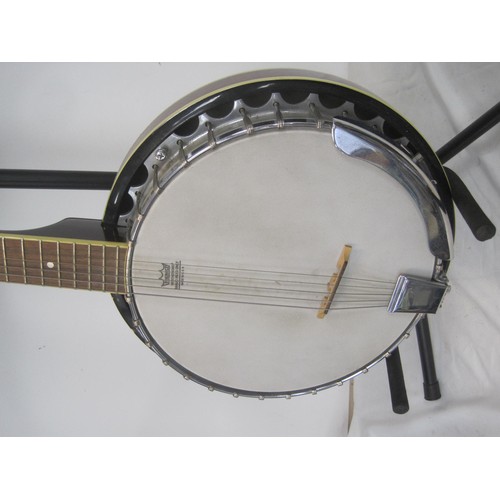 168 - An Ozark banjo, 6 string, with stand, in good order