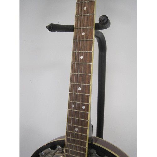 168 - An Ozark banjo, 6 string, with stand, in good order