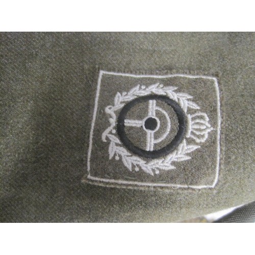 166 - A small vintage Belgian military tunic, battledress style, some insignia present