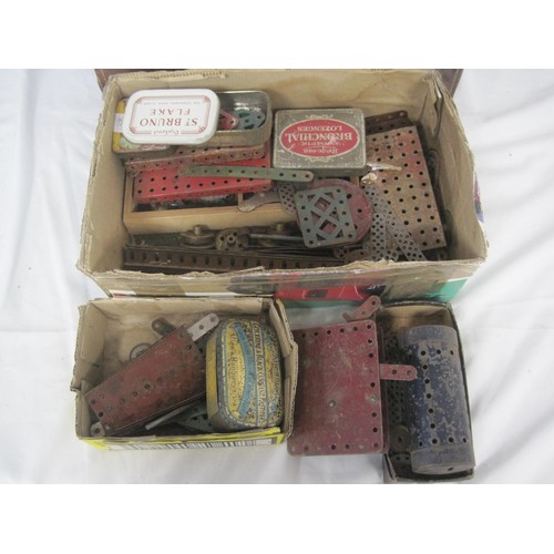 157 - A box of Meccano pieces and a small leather case of the same