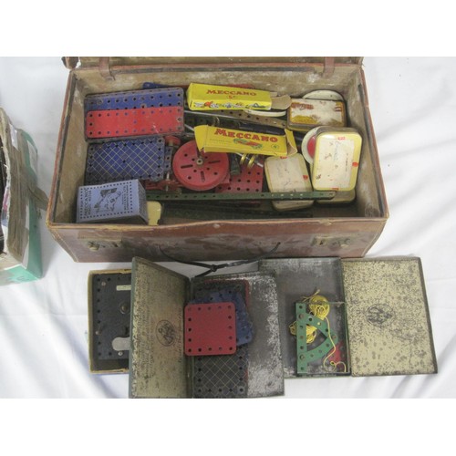 157 - A box of Meccano pieces and a small leather case of the same