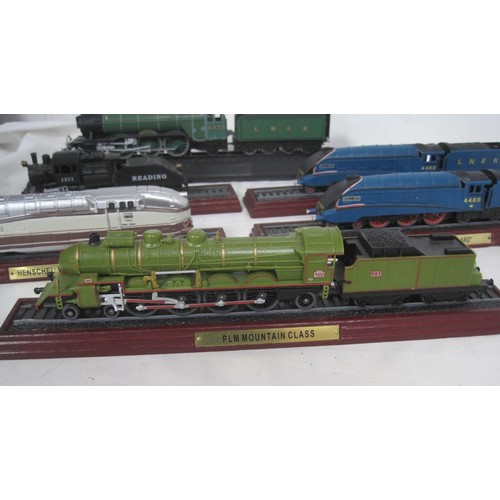 156 - An assortment of steam locomotive engines mounted on plinths