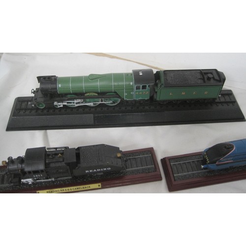 156 - An assortment of steam locomotive engines mounted on plinths