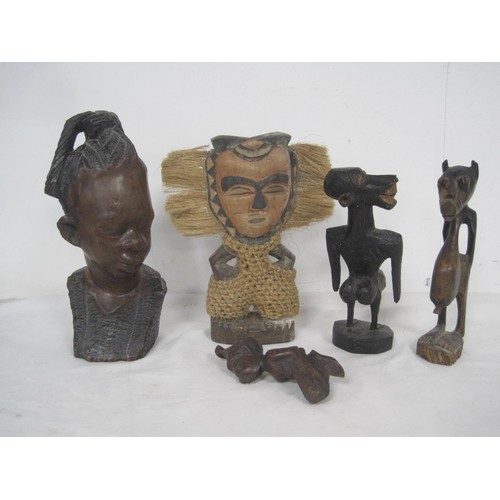 151 - A box of seven Wooden Ethnic Figures