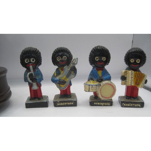 141 - Four Robertson's pottery Golly jazz band figures, and an a/f musical figure 'The Music of the Polyph... 