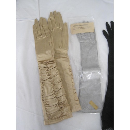 138 - Four pairs of ladies evening gloves, in a cardboard presentation box