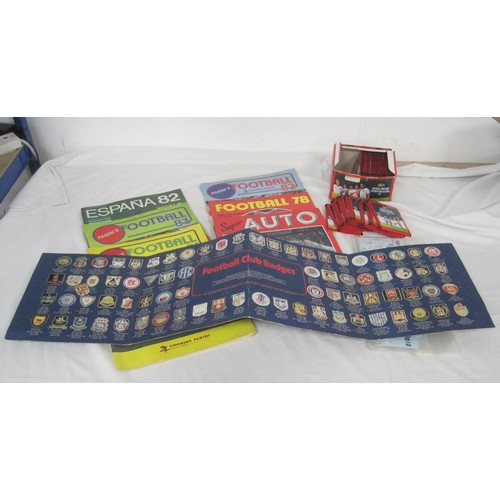 127 - A box of Panini England Sticker Collection packs, a folder of Esso Collection football badges, five ... 