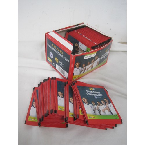 127 - A box of Panini England Sticker Collection packs, a folder of Esso Collection football badges, five ... 