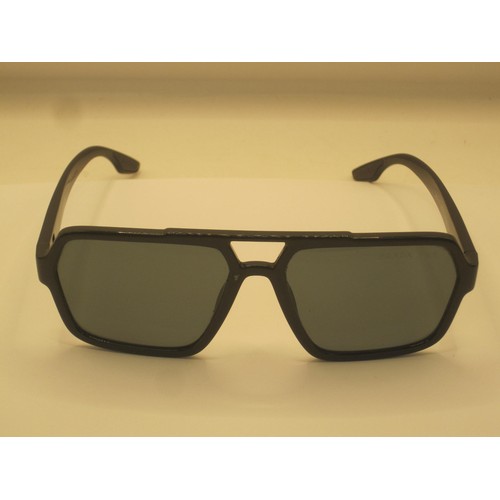 124 - A pair of polarized sunglasses marked Prada, matched with a soft carry case